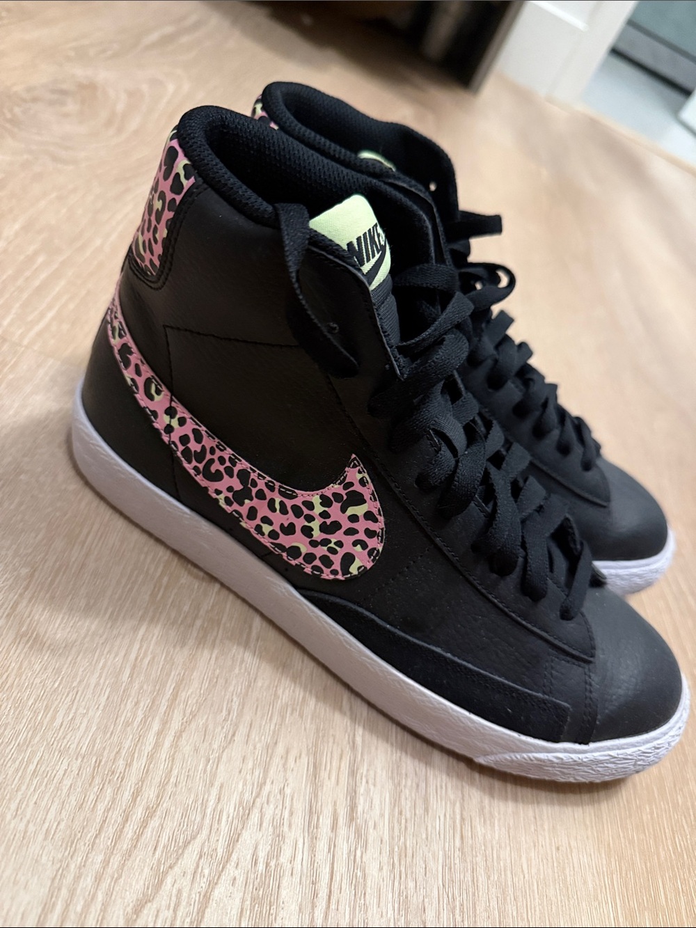 Nike Women's Black High-Top Sneakers with Pink Leopard Swoosh